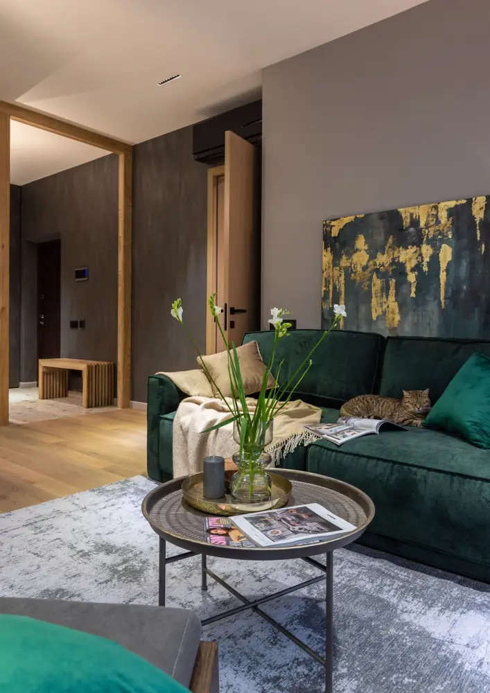 Green sofa and round coffee table in a living room